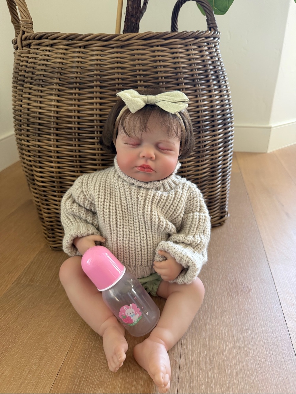 Reborn Doll in Cream Knit Sweater with Pink Bottle and Bow